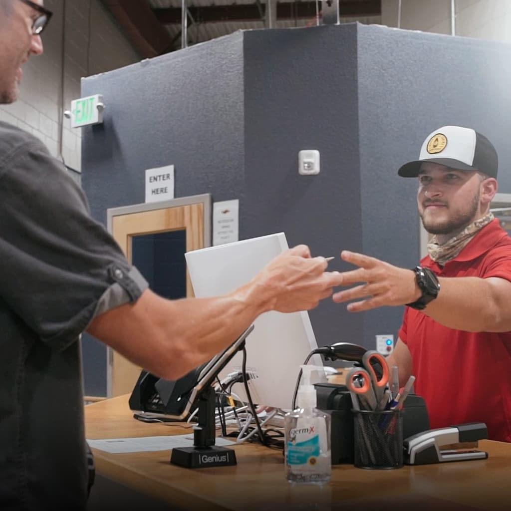 Customer service at Shoot Indoors counter